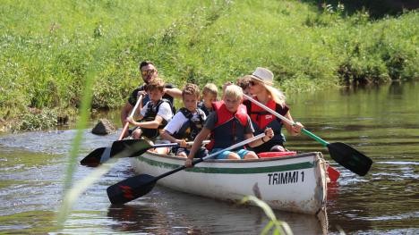 Canoeing children and adults