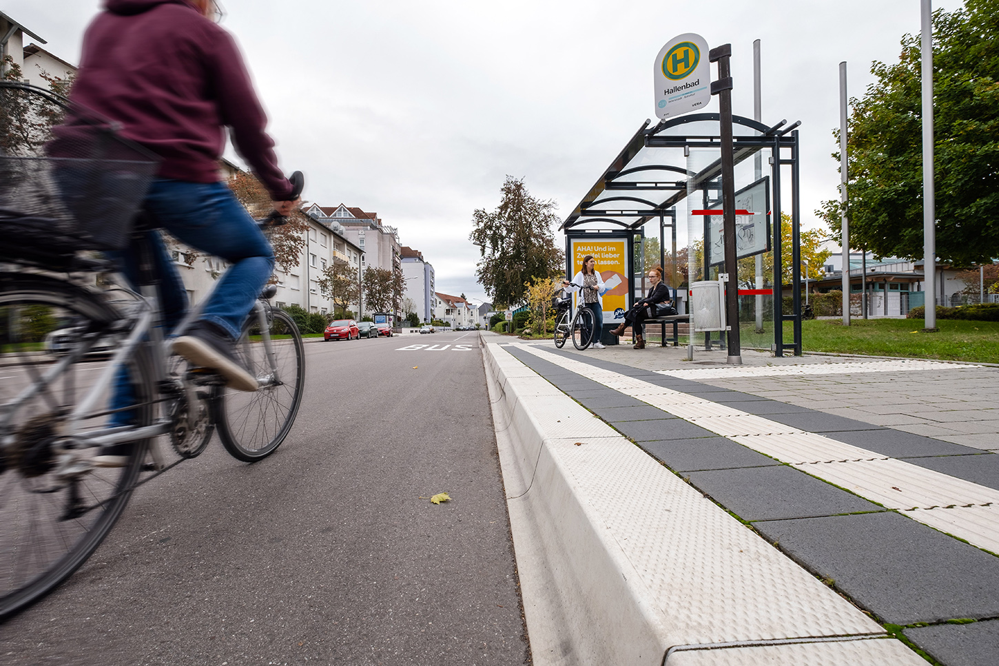 Bicyclists and people at a bus stop in Rastatt