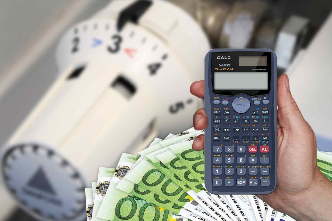 Calculator, money and heating