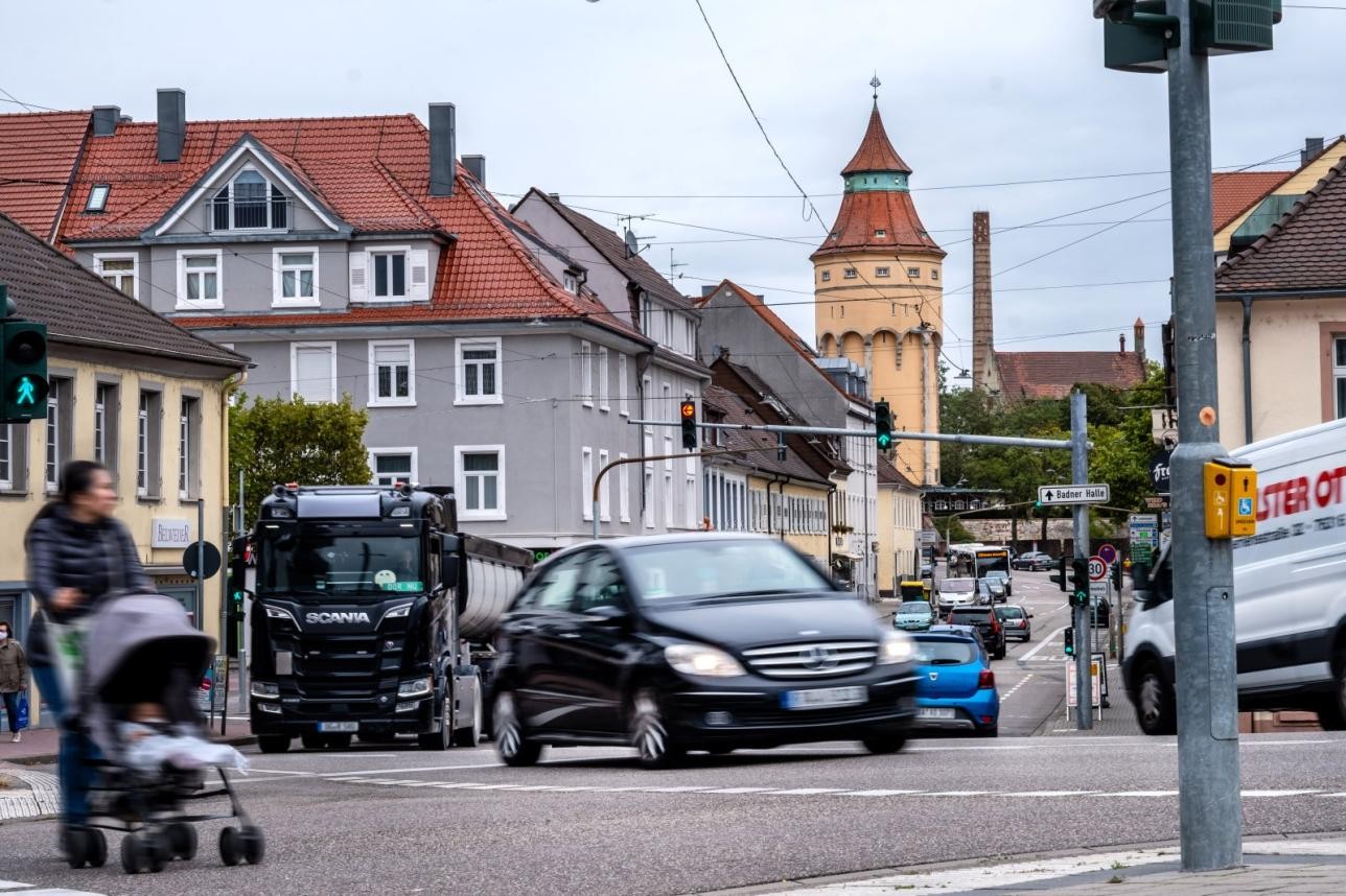 Cars and trucks and pedestrians on the road