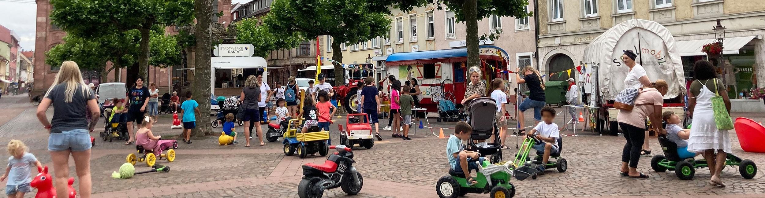 Children play on the market square in Rastatt
