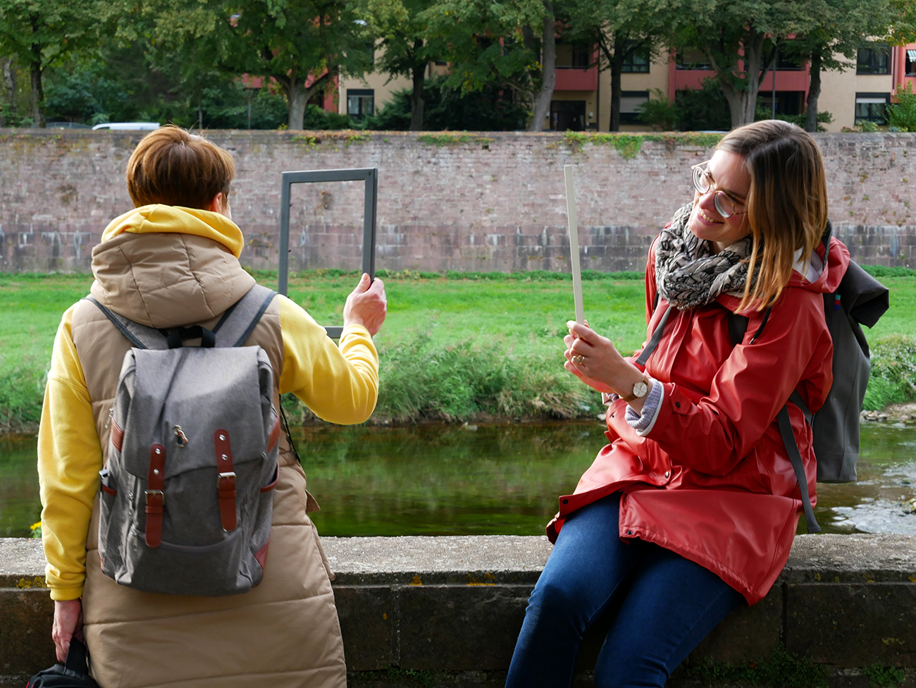 Two women standing by the Murg 